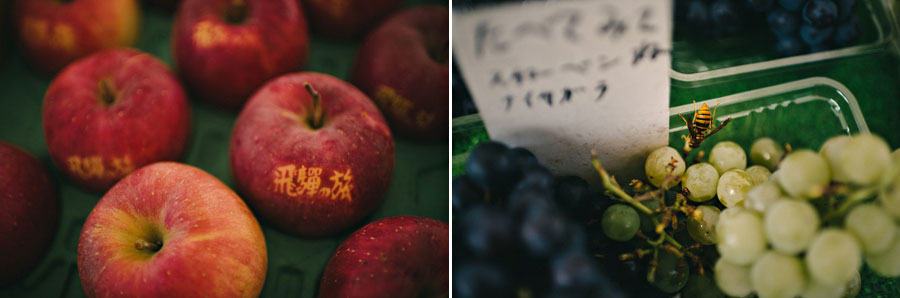Diptych of branded Japanese apples with calligraphy and green grapes with a wasp at a market