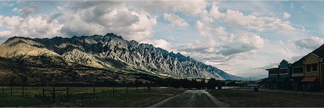 Road leading toward the Remarkables mountain range near Queenstown, New Zealand